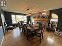 5551 Maxhamish Crescent, Fort Nelson, BC  - Indoor Photo Showing Dining Room With Fireplace 