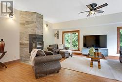 Fireplace woodstove adds heat via fan & ducts - 