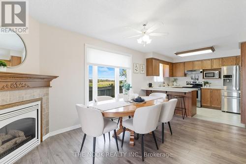 58 Stagemaster Crescent, Clarington (Courtice), ON - Indoor Photo Showing Dining Room With Fireplace