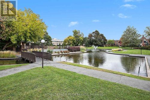 pond / gardens / trails around the property - 2509/2510 - 515 St Laurent Boulevard, Ottawa, ON - Outdoor With Body Of Water