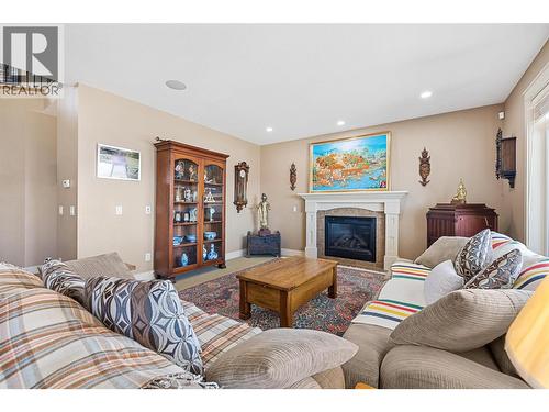 5450 South Perimeter Way, Kelowna, BC - Indoor Photo Showing Living Room With Fireplace