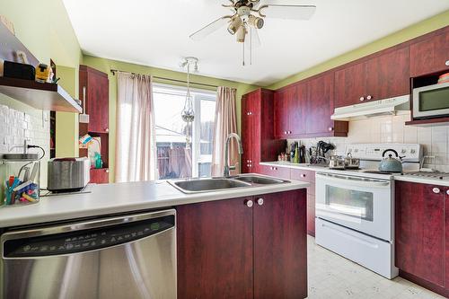 Cuisine - 3940 Rue Ovide, Brossard, QC - Indoor Photo Showing Kitchen With Double Sink