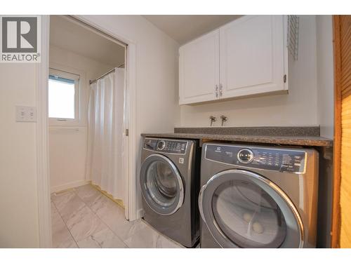 Laundry Room and Full Bath Upstairs - 702 Cypress Drive, Coldstream, BC - Indoor Photo Showing Laundry Room