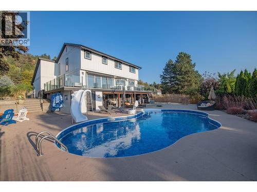 Out door living - 702 Cypress Drive, Coldstream, BC - Outdoor With In Ground Pool With Deck Patio Veranda