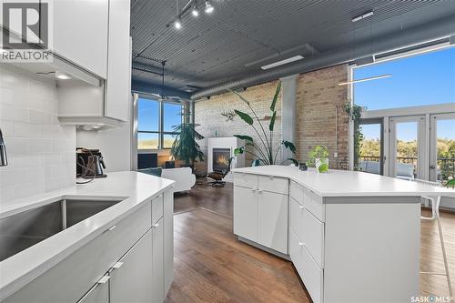503 211 D Avenue N, Saskatoon, SK - Indoor Photo Showing Kitchen With Fireplace