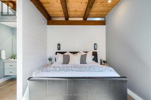 primary sleep area with shiplap feature walls - 589108 Grey Road 19, Blue Mountains, ON - Indoor Photo Showing Bedroom