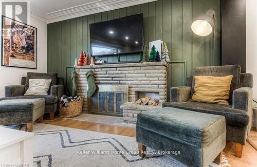 16A - 1085 Queens Boulevard, Kitchener, ON - Indoor Photo Showing Living Room With Fireplace