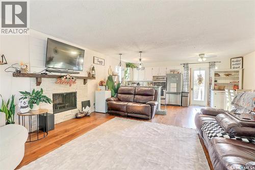 21 Maple Place, Birch Hills, SK - Indoor Photo Showing Living Room With Fireplace