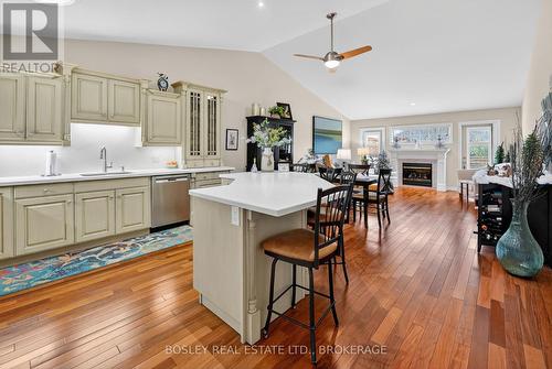 OPEN CONCEPT KITCHEN... - 3 - 21 Loretta Drive W, Niagara-On-The-Lake (Virgil), ON - Indoor Photo Showing Kitchen With Fireplace