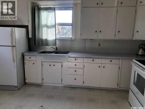306 Cotter Street, Kamsack, SK - Indoor Photo Showing Kitchen With Double Sink