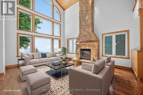 Virtually Staged - 44 Tiny Beaches Road S, Tiny, ON - Indoor Photo Showing Living Room With Fireplace