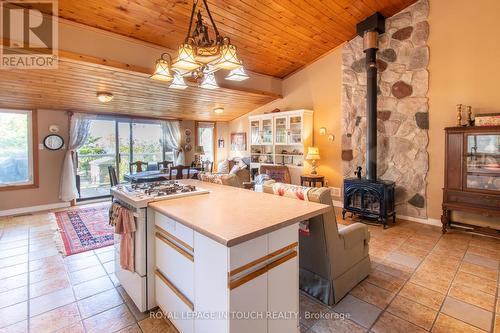 64 Wahnekewening Drive, Tiny, ON - Indoor With Fireplace