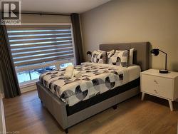 Bedroom featuring wood finished floors - 