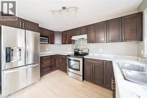 5128 Aerial Crescent, Regina, SK - Indoor Photo Showing Kitchen With Double Sink