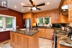 Stylish Kitchen featuring granite counters - 