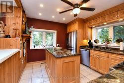 Huge Country Kitchen featuring custom cabinetry - 