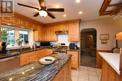 Stylish Kitchen featuring custom cabinetry - 