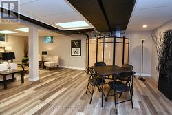 Lower Level games area featuring vinyl flooring - 