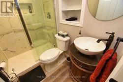 Lower Level Bathroom featuring glass shower - 