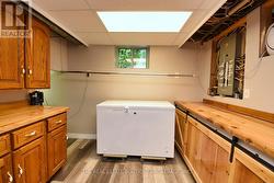 Lower Level Laundry Room featuring lots of storage - 