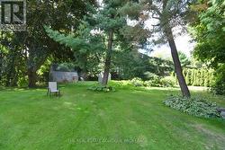 Backyard Oasis featuring two sheds - 