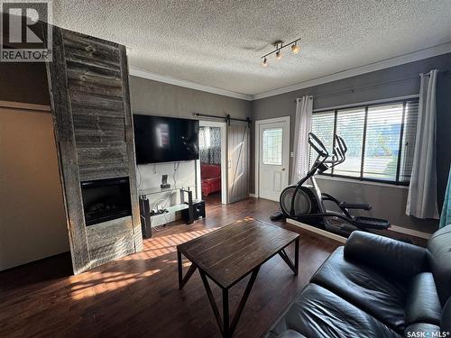307 6Th Avenue E, Biggar, SK - Indoor Photo Showing Living Room With Fireplace
