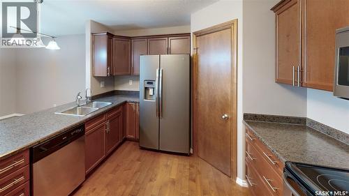 108 3730 Eastgate Drive E, Regina, SK - Indoor Photo Showing Kitchen With Stainless Steel Kitchen With Double Sink