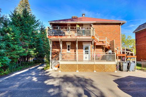 Back facade - 1107  - 1111 Rue De Lanaudière, Joliette, QC - Outdoor With Deck Patio Veranda