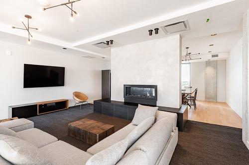 Common room - 603-112 Ch. De La Pointe-Nord, Montréal (Verdun/Île-Des-Soeurs), QC - Indoor Photo Showing Living Room With Fireplace