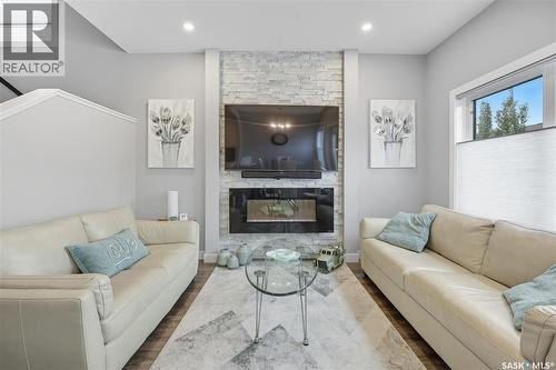 242 Brighton Gate, Saskatoon, SK - Indoor Photo Showing Living Room With Fireplace