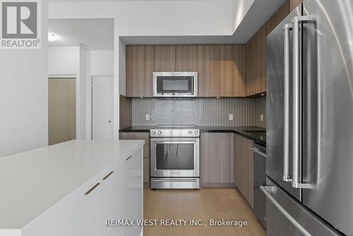 702 - 20 Shore Breeze Drive, Toronto, ON - Indoor Photo Showing Kitchen With Upgraded Kitchen