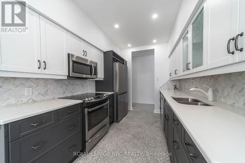 107 - 8111 Forest Glen Drive, Niagara Falls (Mt. Carmel), ON - Indoor Photo Showing Kitchen With Double Sink With Upgraded Kitchen