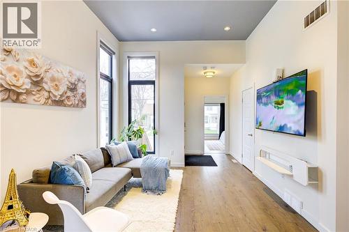 Living room with wood finished floors, healthy amount of natural light, and recessed lighting - 847 Stedwell Street, London, ON - Indoor