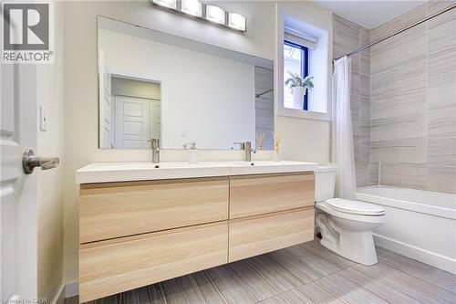 Full bath featuring shower / tub combo with curtain and double vanity - 847 Stedwell Street, London, ON - Indoor Photo Showing Bathroom