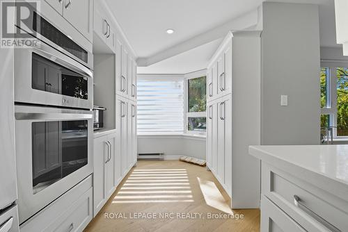 Pantry area, remote control blinds throughout - 2206 - 701 Geneva Street, St. Catharines (Lakeshore), ON - Indoor Photo Showing Kitchen
