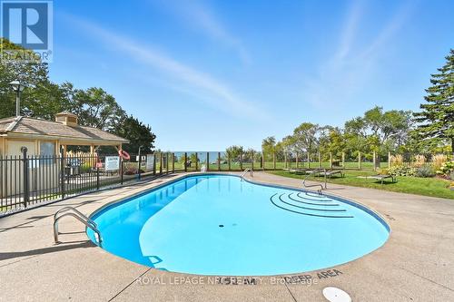 Heated pool and BBQ area - 2206 - 701 Geneva Street, St. Catharines (Lakeshore), ON - Outdoor With In Ground Pool With Backyard