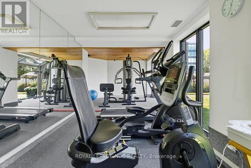 Fitness room overlooking pool & lake, sauna too - 2206 - 701 Geneva Street, St. Catharines (Lakeshore), ON - Indoor Photo Showing Gym Room