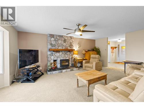 230 Cypress Drive, Coldstream, BC - Indoor Photo Showing Living Room With Fireplace