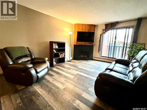 308 1140 9Th Avenue Ne, Swift Current, SK - Indoor Photo Showing Living Room With Fireplace