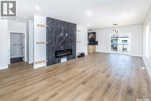 823 Nightingale Road, Saskatoon, SK - Indoor Photo Showing Living Room With Fireplace