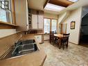 32 11Th Avenue Se, Swift Current, SK  - Indoor Photo Showing Kitchen With Double Sink 