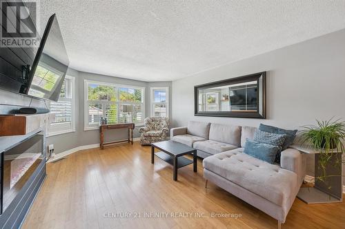 1049 Glenhare Street, Cobourg, ON - Indoor Photo Showing Living Room With Fireplace