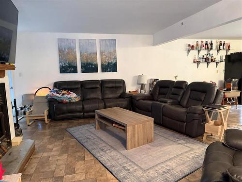 405 Gadwell Place, Duck Mountain Provincial Park, MB - Indoor Photo Showing Living Room With Fireplace