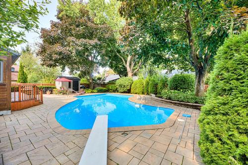 Pool - 107 Av. De Charente, Saint-Lambert, QC - Outdoor With In Ground Pool With Backyard