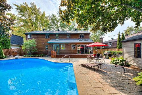Pool - 107 Av. De Charente, Saint-Lambert, QC - Outdoor With In Ground Pool With Deck Patio Veranda