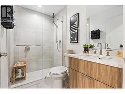 Main bathroom with quartz counters and tile glass shower - 