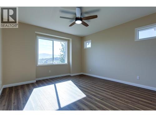 Main floor primary bedroom - 1084 Aurora Heights, West Kelowna, BC - Indoor Photo Showing Other Room