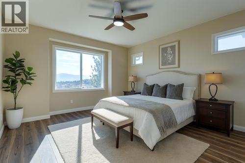 primary bedroom virtually staged - 1084 Aurora Heights, West Kelowna, BC - Indoor Photo Showing Bedroom