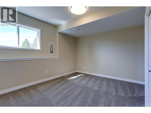 Bedroom dowm - 1084 Aurora Heights, West Kelowna, BC - Indoor Photo Showing Other Room