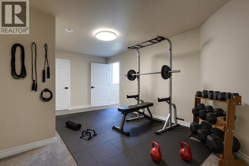 bonus room virtually staged - 1084 Aurora Heights, West Kelowna, BC - Indoor Photo Showing Gym Room
